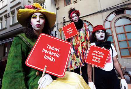 Artists hold banners during a HIV/AIDS awareness rally on World AIDS day in Istanbul,